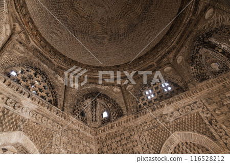 Samanid Mausoleum interior detail with arched windows and dome 116528212