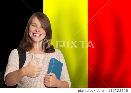 Beautiful young woman student against Belgian flag background. Travel, education and learn language Beautiful young woman student against Belgian flag background. Travel, education and learn language 116528226