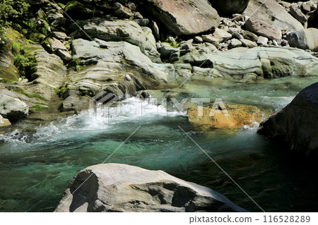 The clear waters of the Asemi River flowing through a valley of folded metamorphic rocks The clear waters of the Asemi River flowing through a valley of folded metamorphic rocks 116528289
