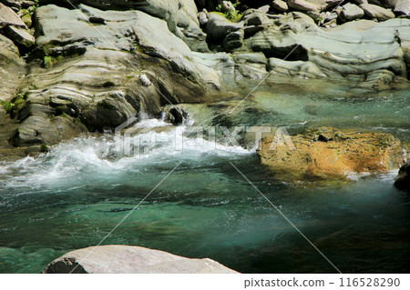 The clear waters of the Asemi River flowing through a valley of folded metamorphic rocks The clear waters of the Asemi River flowing through a valley of folded metamorphic rocks 116528290