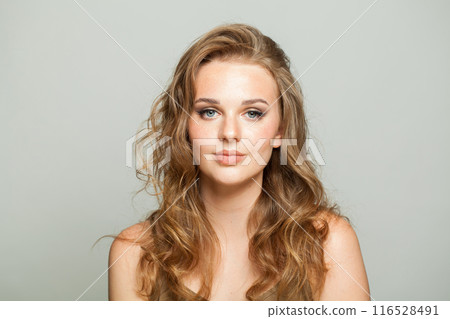 Gorgeous smiling young adult woman studio photo 116528491