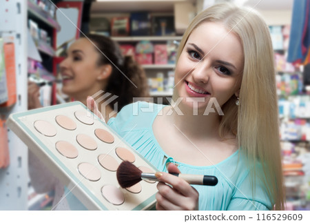 Female customer buying skin powder 116529609
