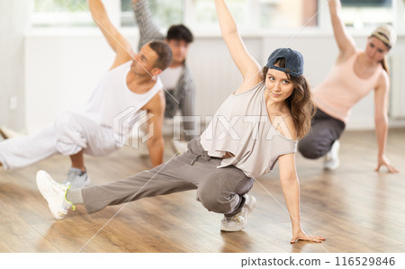 Young girl practicing breakdance floor-works in training hall Young girl practicing breakdance floor-works in training hall 116529846