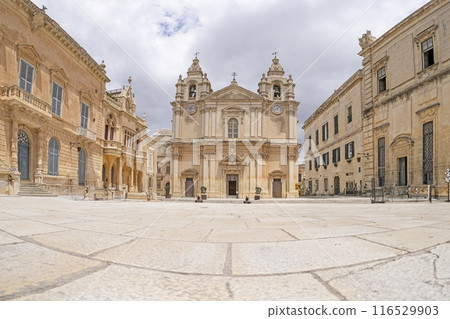 Panoramic picture of St. Paul's Cathedral in the historic Maltese city of Mdina with a deserted forecourt Panoramic picture of St. Paul's Cathedral in the historic Maltese city of Mdina with a deserted forecourt 116529903