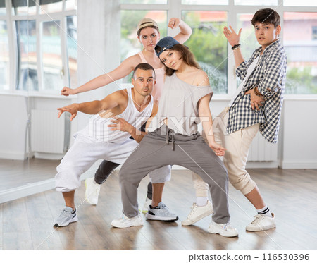 Women and men improvise, move on whim, and perform voluntary movements hip hop dance Women and men improvise, move on whim, and perform voluntary movements hip hop dance 116530396