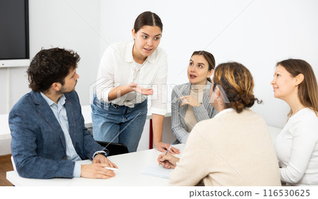 Team building for employees discussing problems of work, feeling psychological support during psychological trainings 116530625