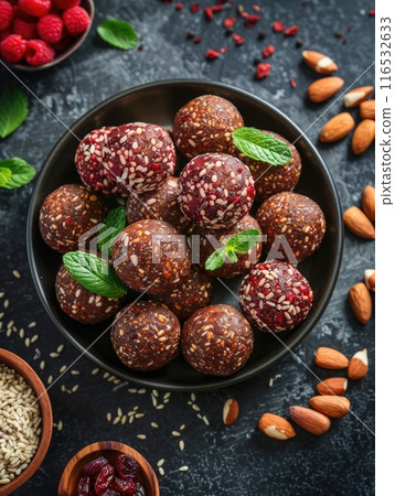 Healthy energy balls made of dried fruits and nuts healthy food. 116532633
