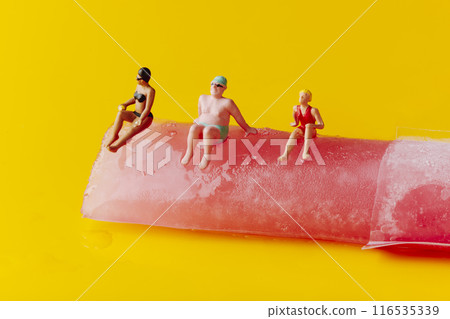 miniature people in swimsuit on a freeze pop 116535339