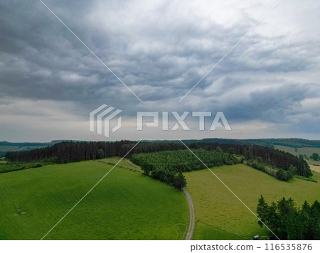 Scenic Landscape with Green Fields and Dramatic Sky Scenic Landscape with Green Fields and Dramatic Sky 116535876