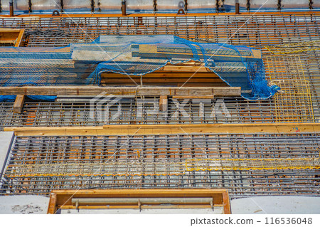 Steel bars and formwork at a construction site Steel bars and formwork at a construction site 116536048