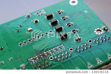 Row of identical microcontrollers soldered into an electronic board Row of identical microcontrollers soldered into an electronic board 116536118