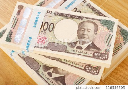 A large stack of 10,000 yen bills A large stack of 10,000 yen bills 116536305