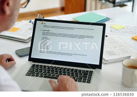 Marketer Examining Data On Laptop Marketer Examining Data On Laptop 116536830