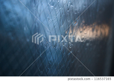Water droplets attached to the glass 116537165