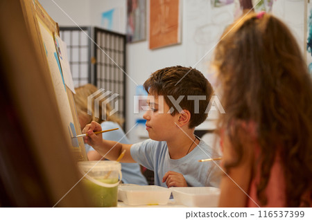 Woman plays tennis on the court Woman plays tennis on the court 116537399