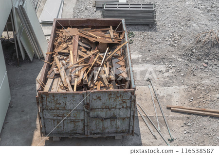 Containers loaded with timber removed during wooden demolition Containers loaded with timber removed during wooden demolition 116538587