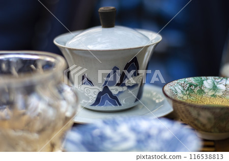 Traditional chinese porcelain teapot and cups on the table Traditional chinese porcelain teapot and cups on the table 116538813