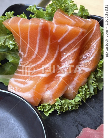 Salmon sashimi on black plate, japanese cuisine Salmon sashimi on black plate, japanese cuisine 116538833