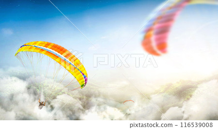 Paragliding multicolor. Paraglider flying over Landscape from the background Beauty nature mountain landscape of the sky. Paragliding Sports. Concept of extreme sport, taking adventure challenge. 116539008