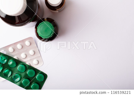 Pills, blister pack and medicine bottles top view. Vitamins, supplements. Concept of health care. Medicine dose. Medicinal treatment. Health. Copy space, online pharmacy banner. High quality photo 116539221