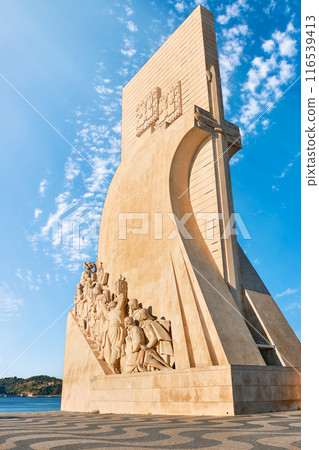 Monument to Discoveries or Padrao dos Descobrimentos to Age of Discovery shaped as ship and sword with statues of Prince Henry the Navigator and great people of Portuguese seafarers history, Lisbon 116539413