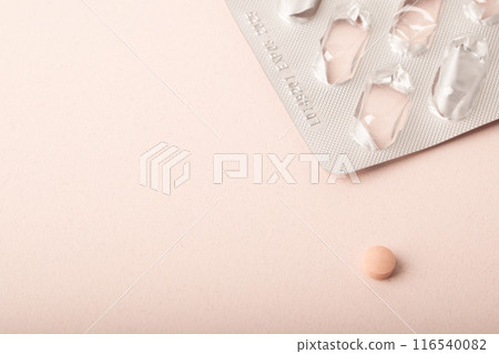 Pink pill, blister pack close up isolated on pink background. Medicine dose. Medicinal treatment, vitamins, supplements, contraceptive pills. Womens health. Copy space, banner. High quality photo Pink pill, blister pack close up isolated on pink background. Medicine dose. Medicinal treatment, vitamins, supplements, contraceptive pills. Womens health. Copy space, banner. High quality photo 116540082