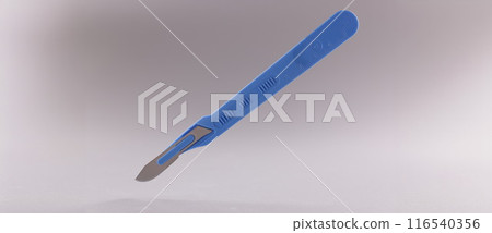 Scalpel, surgical stainless steel metal instrument on grey background Scalpel, surgical stainless steel metal instrument on grey background 116540356