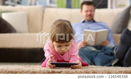 Little girl kid watching cartoon on smartphone device, digital entertainment for child Little girl kid watching cartoon on smartphone device, digital entertainment for child 116540386