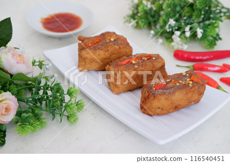 Spicy fried tofu filled with meat 116540451
