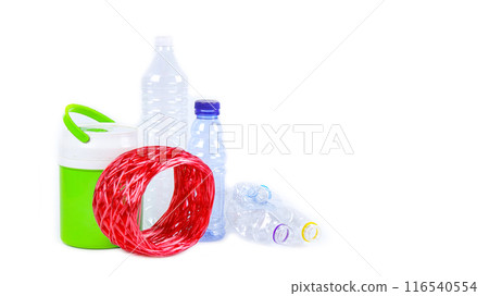Clear plastic bottles on a white surface, awaiting recycling. Clear plastic bottles on a white surface, awaiting recycling. 116540554