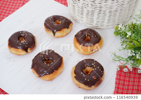 donuts with delicious chocolate coating as a background 116540939