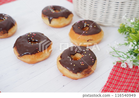 donuts with delicious chocolate coating as a background donuts with delicious chocolate coating as a background 116540949