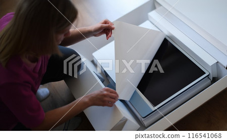 Woman hands unpacking box with modern personal computer 116541068