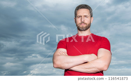 Portrait of grizzled guy sky background. Serious guy keeping arms crossed. Confident guy outdoors Portrait of grizzled guy sky background. Serious guy keeping arms crossed. Confident guy outdoors 116541873