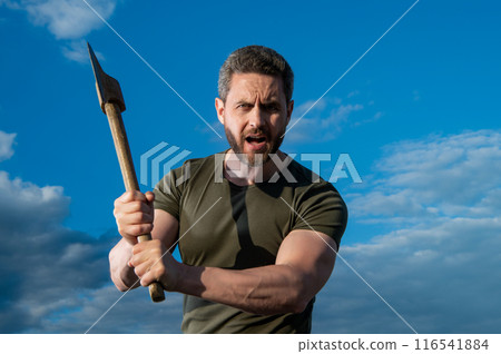 man threaten with axe. shouting man hold ax. brutal man on sky background man threaten with axe. shouting man hold ax. brutal man on sky background 116541884