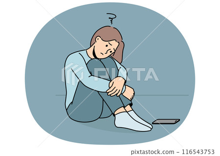Sad woman is waiting for phone call, sitting on floor and suffering from loneliness or lack friends 116543753