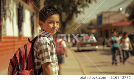 a young boy with a backpack, smiling as he walks to school in a lively street scene in Mexico a young boy with a backpack, smiling as he walks to school in a lively street scene in Mexico 116543775