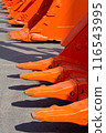 Group of orange excavator scoops 116543995