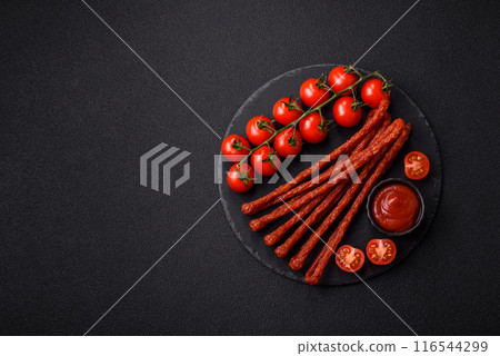 Mini sausages or cabanosi smoked with salt and spices 116544299