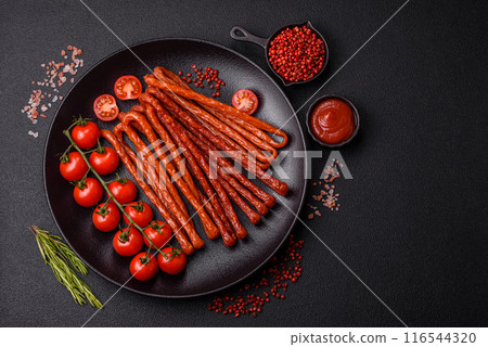 Mini sausages or cabanosi smoked with salt and spices Mini sausages or cabanosi smoked with salt and spices 116544320