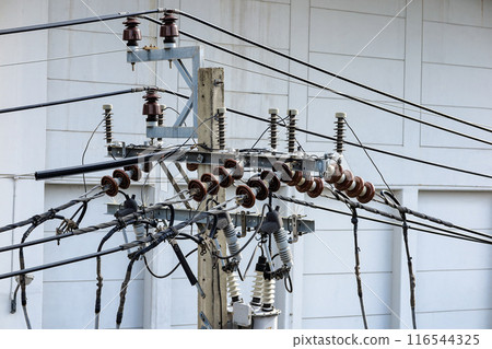 Close view of high voltage post, High voltage tower, show with high voltage construction and power lines, with blue sky background. 116544325