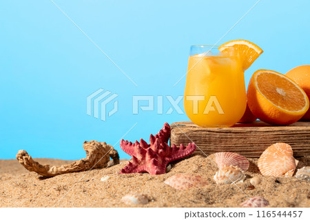 Orange cocktail with ice on a old wooden board. Orange cocktail with ice on a old wooden board. 116544457