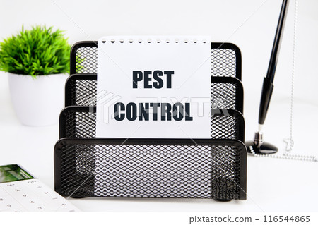 Pest Control written on a piece of paper on a white background 116544865