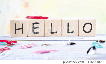 Communication concept, introduction. HELLO word it is made of wooden cubes on a colored background Communication concept, introduction. HELLO word it is made of wooden cubes on a colored background 116544879