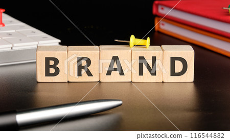 Inbound marketing strategy. Copy space. A word BRAND on wooden cubes on a black background with business notebooks, calculator and pen Inbound marketing strategy. Copy space. A word BRAND on wooden cubes on a black background with business notebooks, calculator and pen 116544882