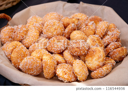Puff pastries, round sugar-coated sugar puffs, golden crispy baked sweets, traditional French patisserie, biscuits Puff pastries, round sugar-coated sugar puffs, golden crispy baked sweets, traditional French patisserie, biscuits 116544936