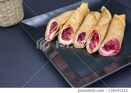 Stylish Dessert Crepes with Berry Filling 116545122