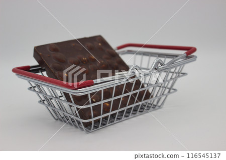 Chocolate Bar with Nuts in Shopping Basket 116545137