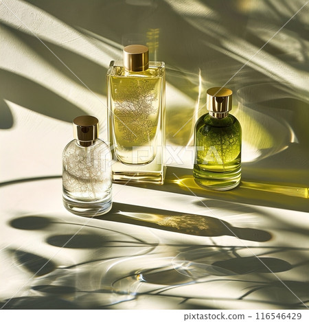 Discover elegant perfume bottles with luxe fragrances, capturing sunlit shadows and sophistication 116546429