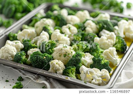 A Symphony of Greens and Whites: Broccoli and Cauliflower Roasting in a Silver Pan A Symphony of Greens and Whites: Broccoli and Cauliflower Roasting in a Silver Pan 116546897